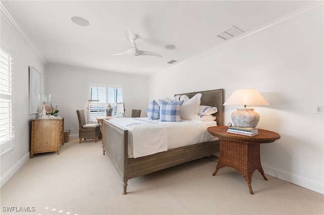 carpeted bedroom featuring ceiling fan and ornamental molding