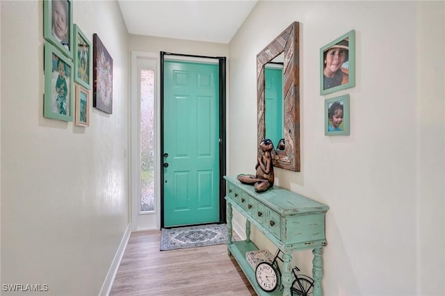 doorway to outside with light hardwood / wood-style floors