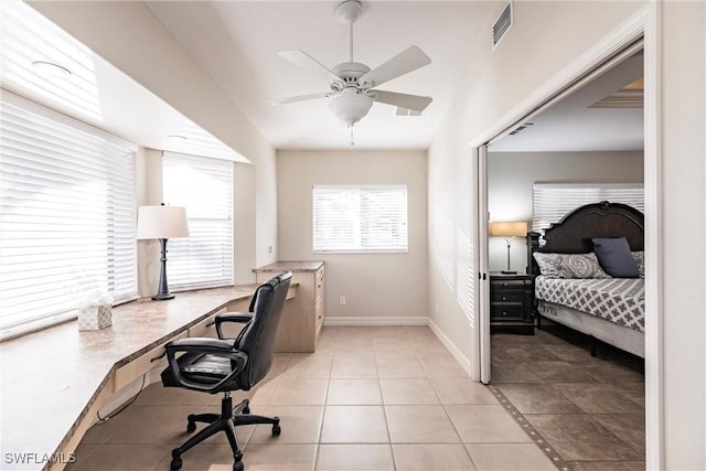 office space featuring ceiling fan and light tile patterned flooring