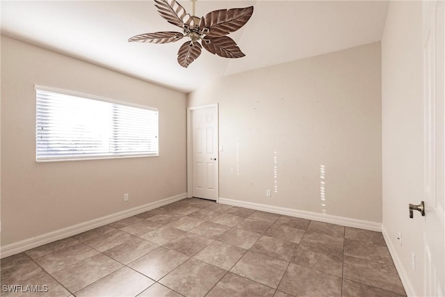 unfurnished room with light tile patterned floors and ceiling fan