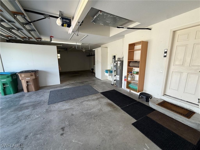 garage featuring a garage door opener and electric water heater