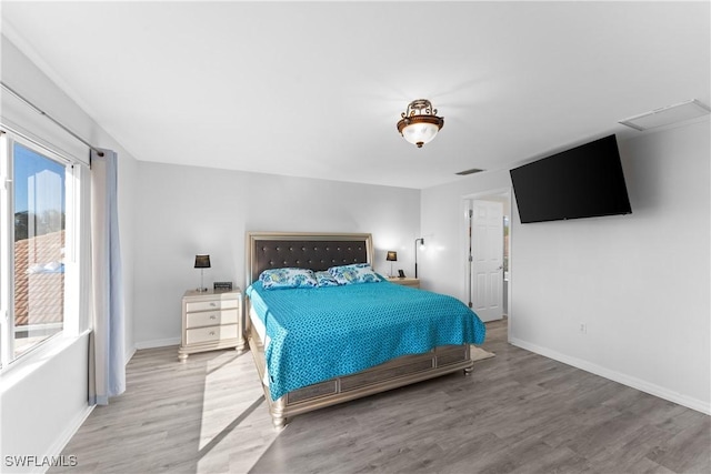 bedroom featuring wood-type flooring