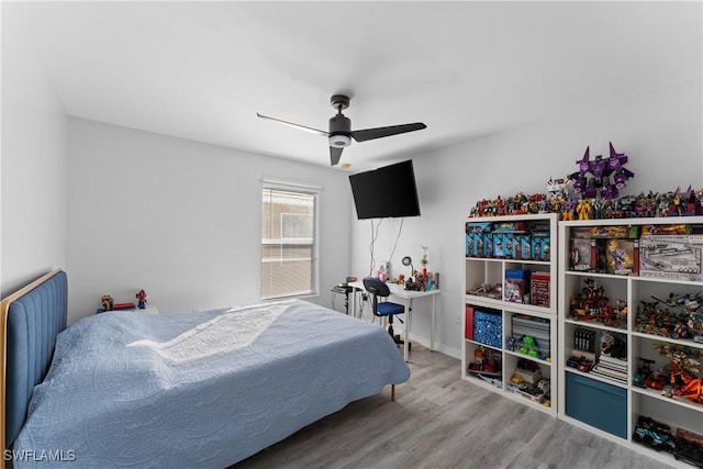 bedroom featuring ceiling fan and wood-type flooring