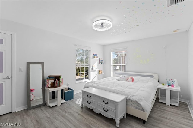 bedroom with light hardwood / wood-style flooring