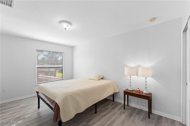 bedroom featuring light wood-type flooring