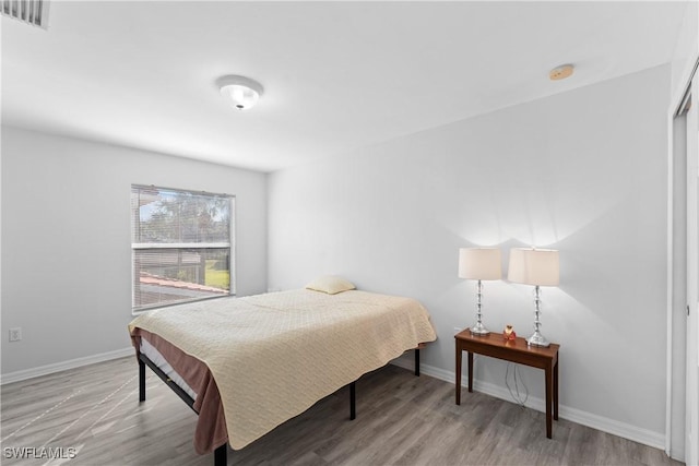 bedroom with light wood-type flooring