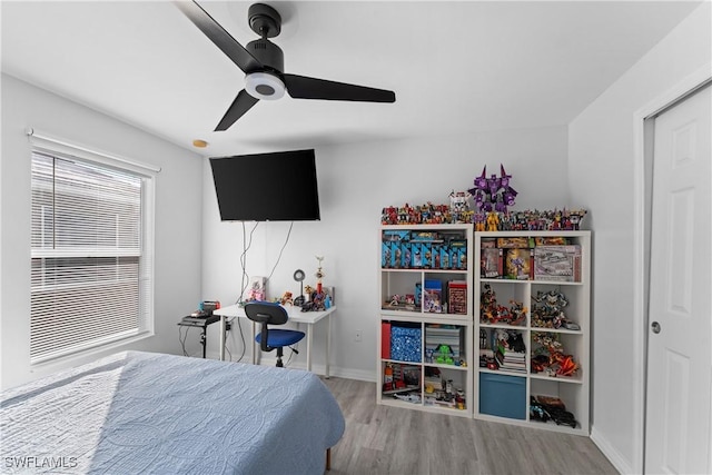 bedroom featuring ceiling fan and wood-type flooring