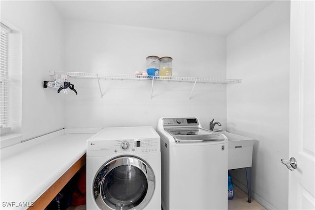 laundry room with washing machine and dryer