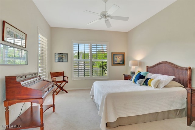 bedroom featuring ceiling fan and light carpet