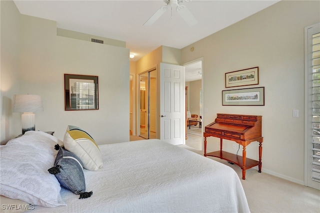 carpeted bedroom with a closet and ceiling fan