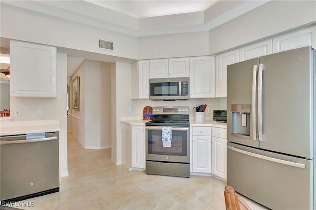 kitchen with white cabinetry and appliances with stainless steel finishes