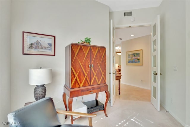 interior space featuring light carpet and french doors