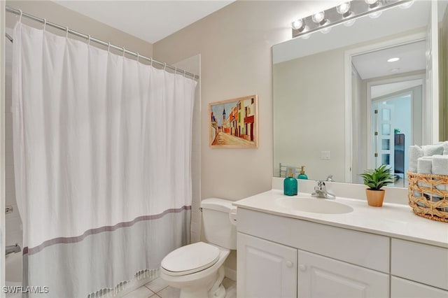 bathroom with tile patterned floors, vanity, curtained shower, and toilet