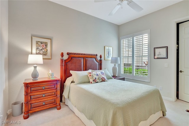 bedroom featuring light carpet and ceiling fan