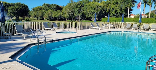 view of pool featuring a patio