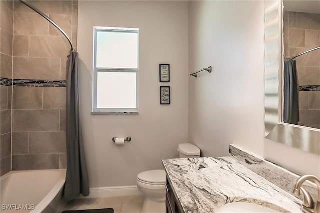 full bathroom featuring tile patterned flooring, vanity, toilet, and shower / tub combo with curtain