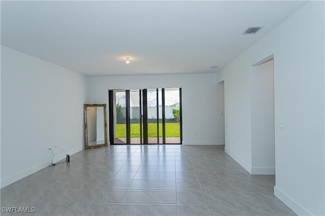 view of tiled spare room