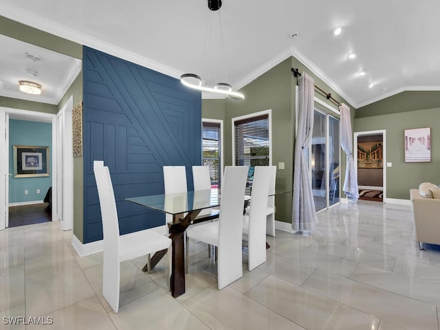 dining area with vaulted ceiling and crown molding