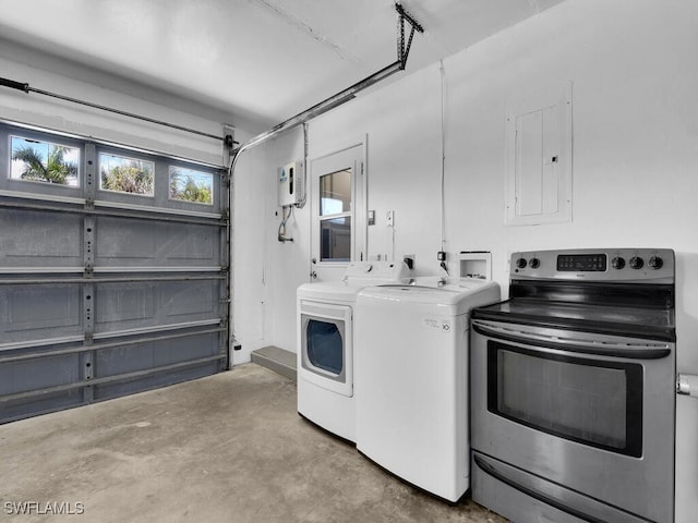 laundry area with electric panel and separate washer and dryer