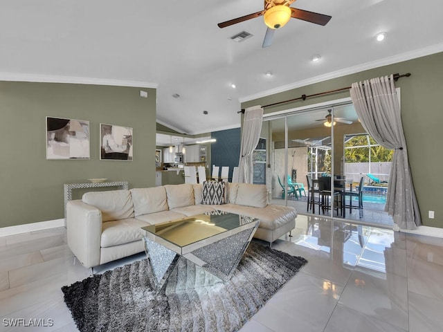 tiled living room featuring ceiling fan, lofted ceiling, and ornamental molding