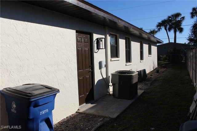 view of side of home with cooling unit