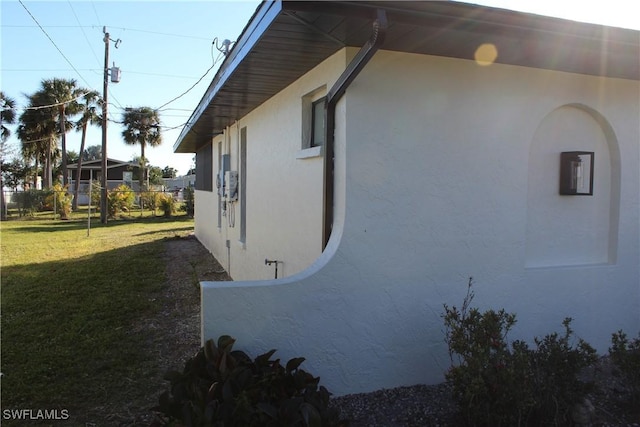 view of home's exterior featuring a yard