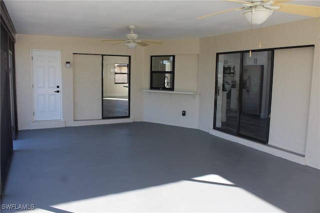 view of patio / terrace featuring ceiling fan