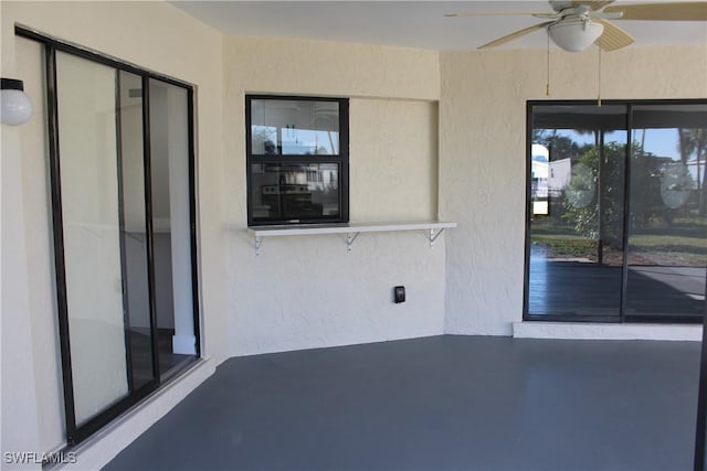 view of patio featuring ceiling fan