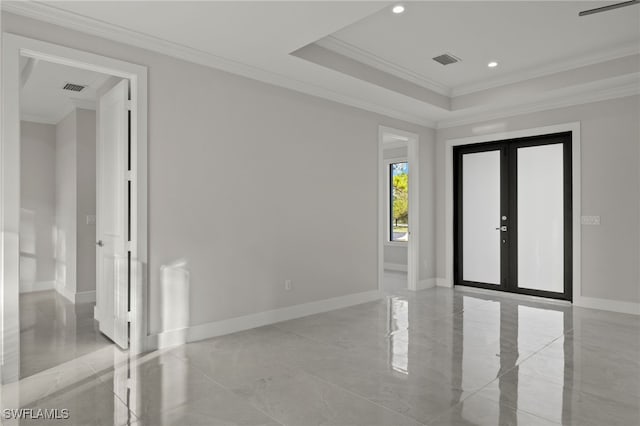 spare room featuring french doors and ornamental molding