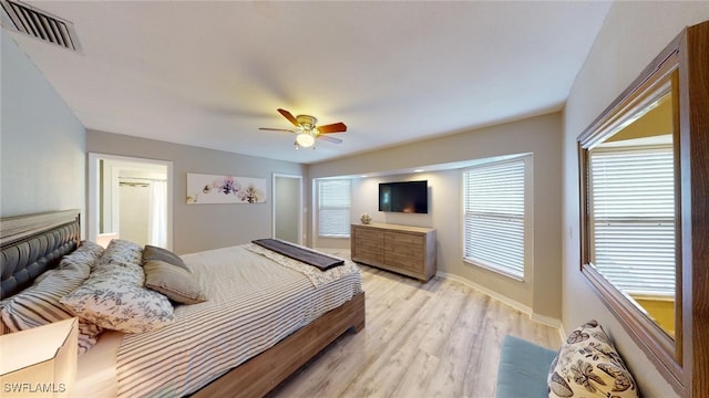 bedroom featuring light hardwood / wood-style flooring and ceiling fan