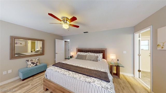 bedroom with ceiling fan and light hardwood / wood-style flooring