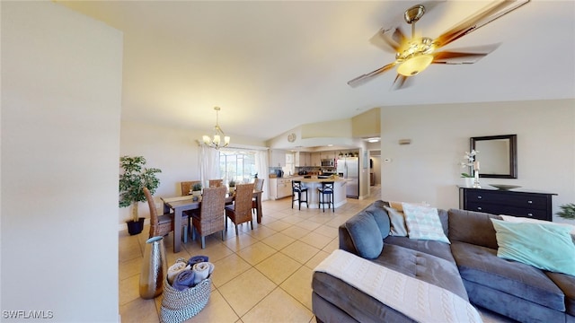 tiled living room with ceiling fan with notable chandelier and vaulted ceiling