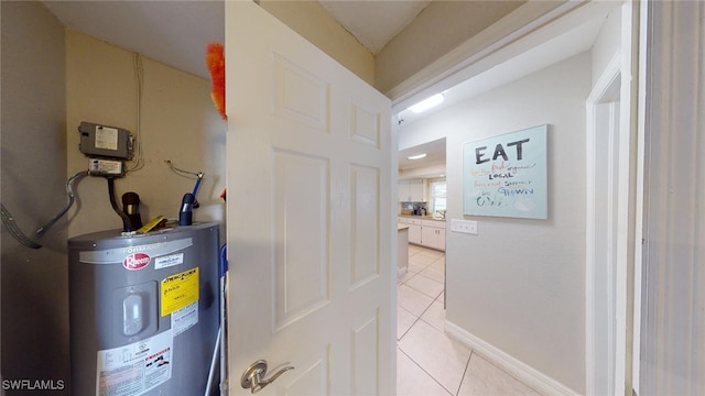 utility room featuring water heater