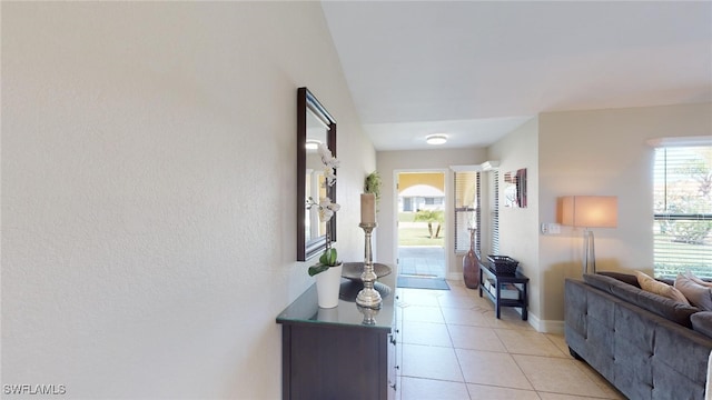 hall featuring light tile patterned floors