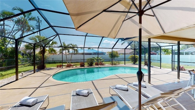 view of pool with a lanai and a patio