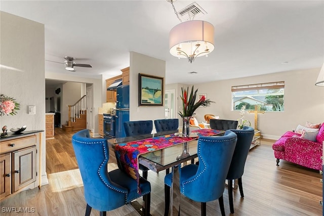 dining area featuring ceiling fan and light hardwood / wood-style floors