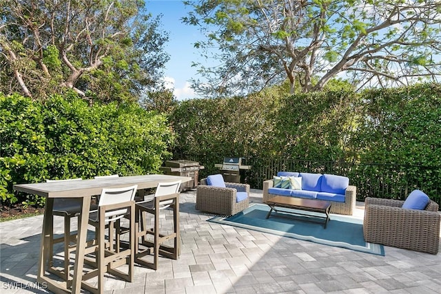 view of patio / terrace featuring outdoor lounge area and an outdoor kitchen