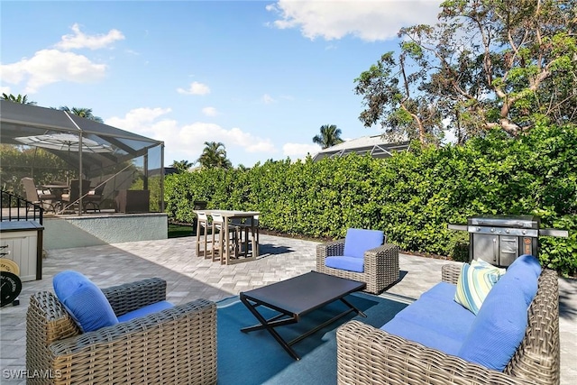 view of patio / terrace featuring area for grilling and glass enclosure