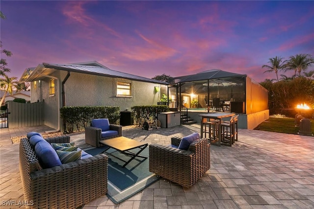 patio terrace at dusk with an outdoor hangout area