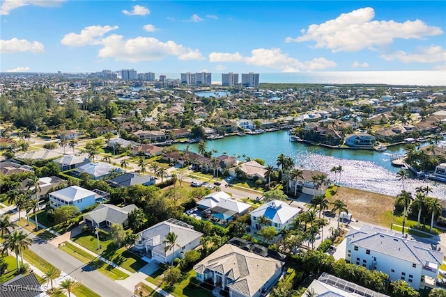 birds eye view of property featuring a water view