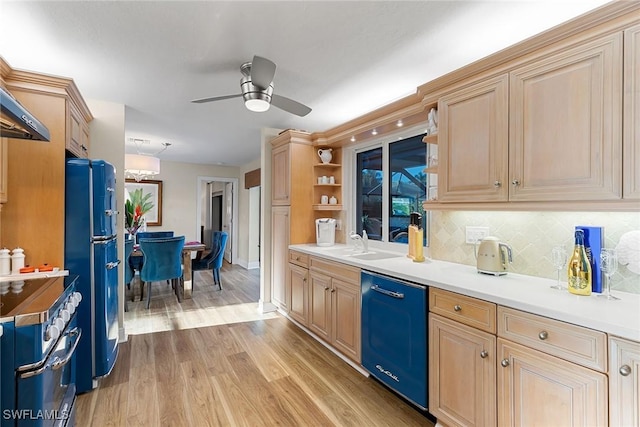 kitchen with tasteful backsplash, ceiling fan, sink, black appliances, and light hardwood / wood-style floors