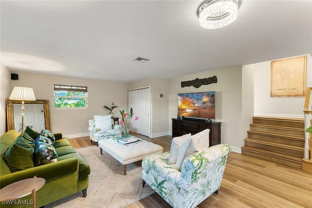 living room with light hardwood / wood-style flooring