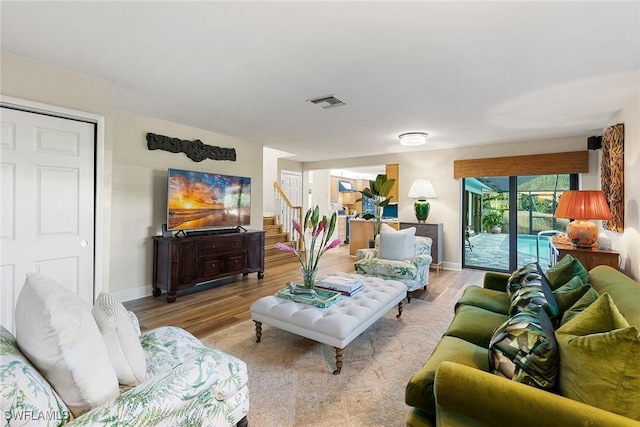 living room with light hardwood / wood-style floors