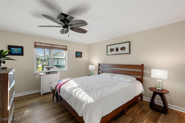 bedroom featuring dark hardwood / wood-style floors and ceiling fan