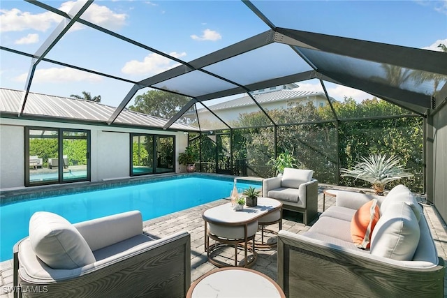 view of swimming pool with a lanai, an outdoor hangout area, and a patio