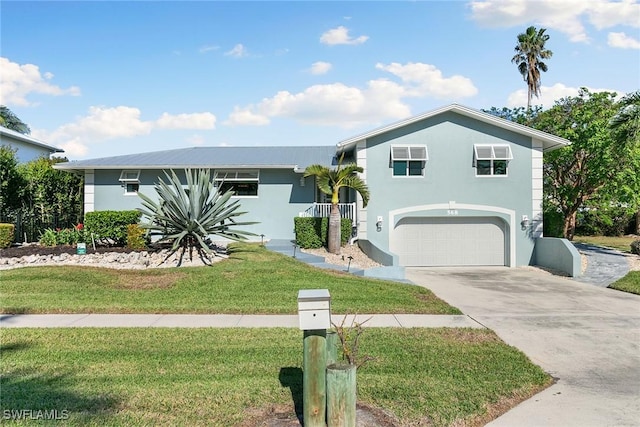 view of front facade with a garage and a front yard