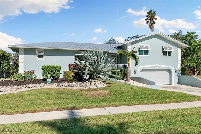 view of front of property with a garage, a front lawn, and a porch