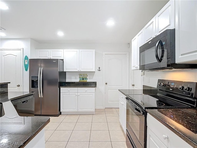 kitchen featuring black appliances, white cabinets, light tile patterned floors, and dark stone countertops