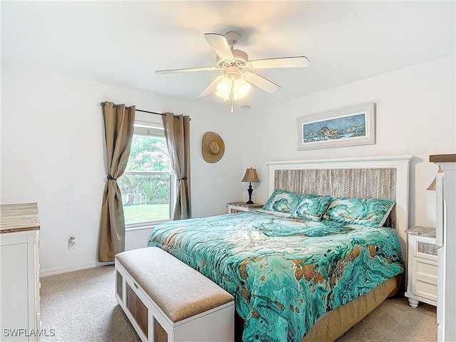 bedroom with light carpet and ceiling fan