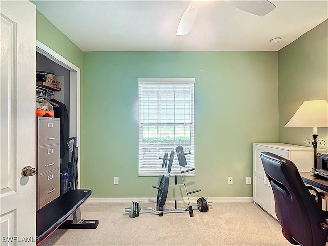 office featuring ceiling fan and light carpet